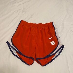 Nike Women's Orange Athletic Shorts with Purple Trim and White Logos